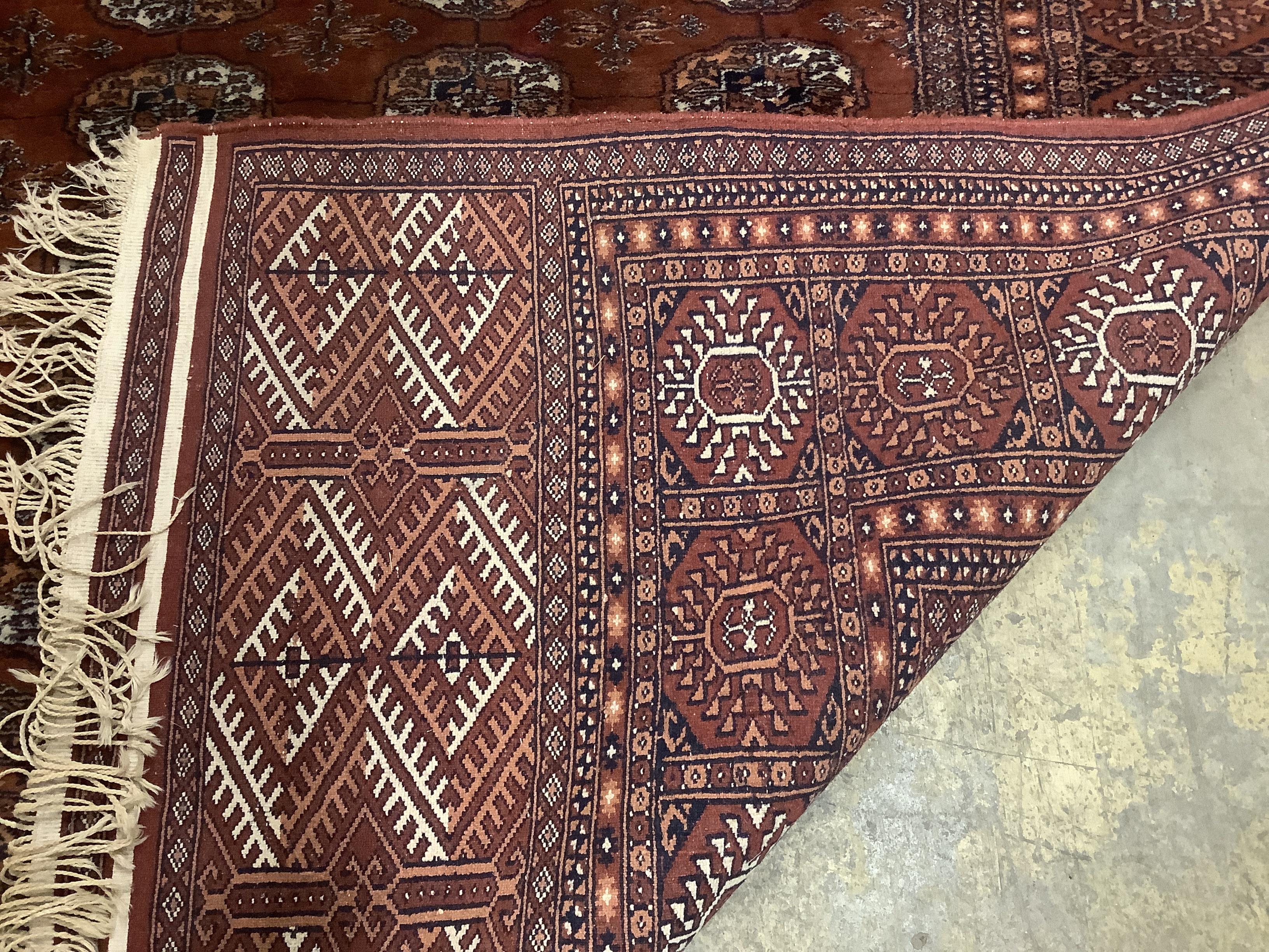 A Bokhara red ground carpet,310 x 237cm